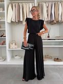Black Daisy elegant pleated two-piece set by Lumina Wear, featuring a flattering fit and stylish design.
