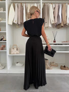 Black Daisy elegant pleated two-piece set by Lumina Wear, featuring a flattering fit and stylish clothing set design.