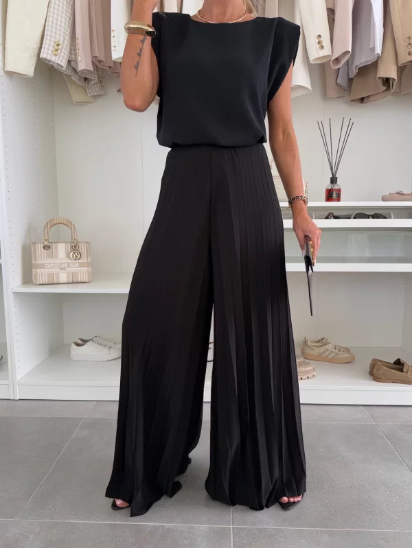 Elegant Daisy black pleated two-piece clothing set by Lumina Wear, featuring a flattering fit and stylish design.