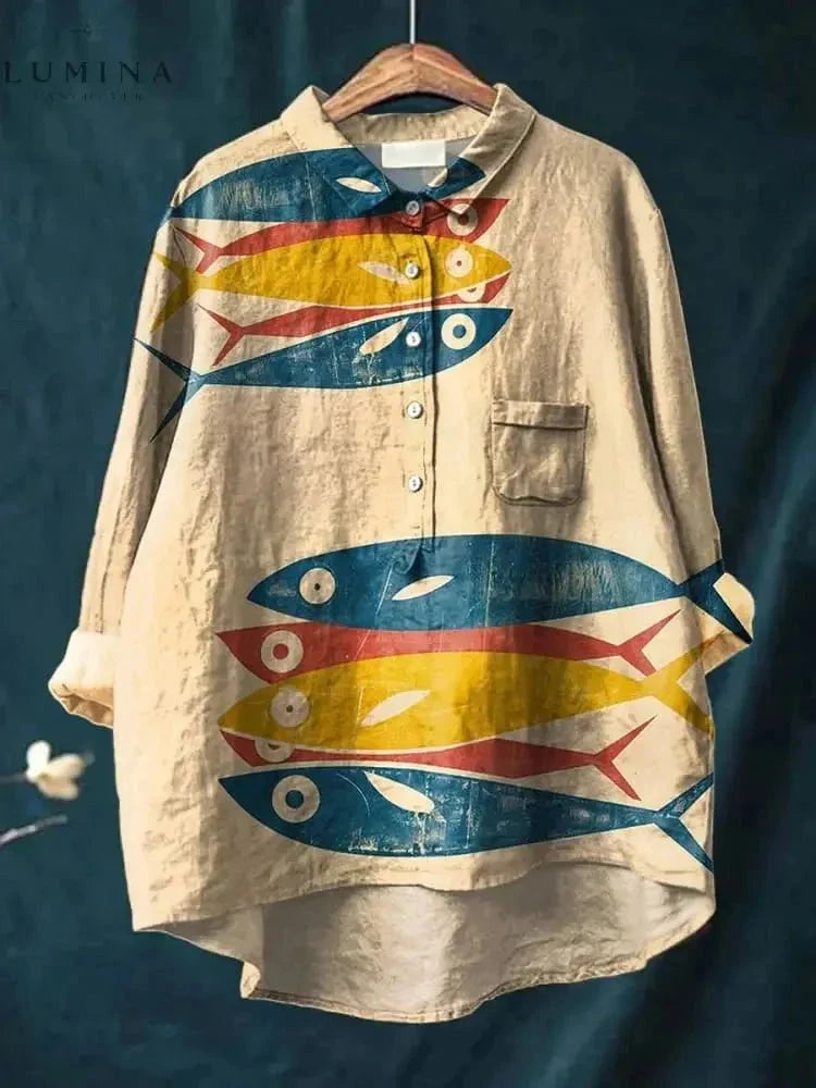 Dana Fish Print T-shirt by Lumina Vancouver, featuring a vibrant fish design on a casual tee, displayed on a white background.