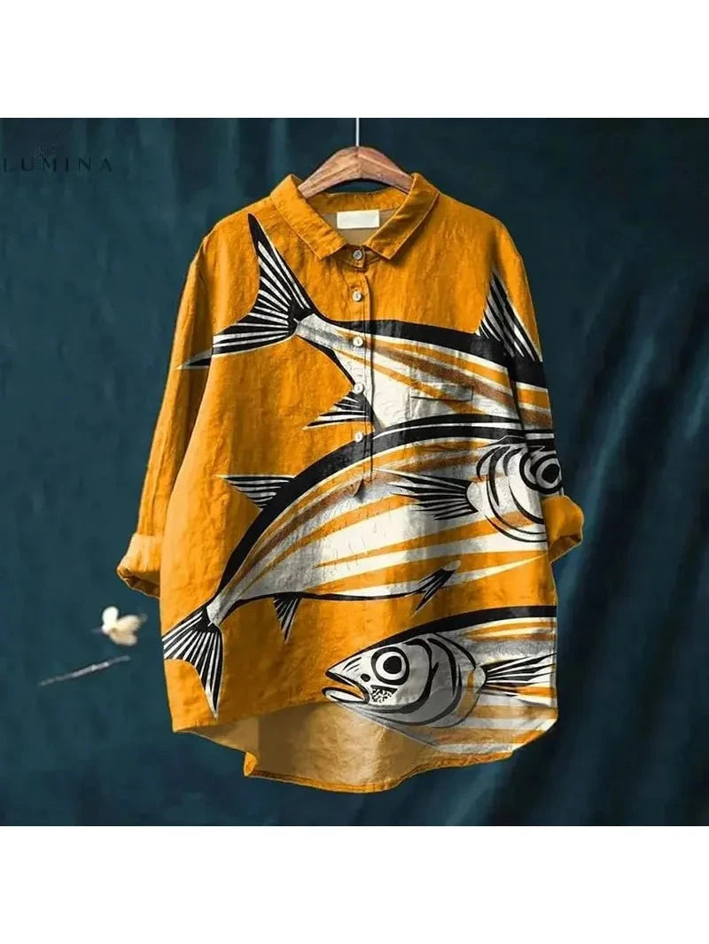 Dana Fish Print Tee by Lumina Vancouver featuring a colorful fish illustration on a casual white cotton t-shirt.