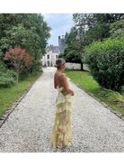 Pink Darcel sleeveless long wedding guest dress by Lumina Vancouver, showing elegant fabric and flattering fit for special occasions.
