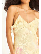 Pink Darcel sleeveless long wedding guest dress by Lumina Vancouver, displayed on a model with flowing fabric and elegant design.