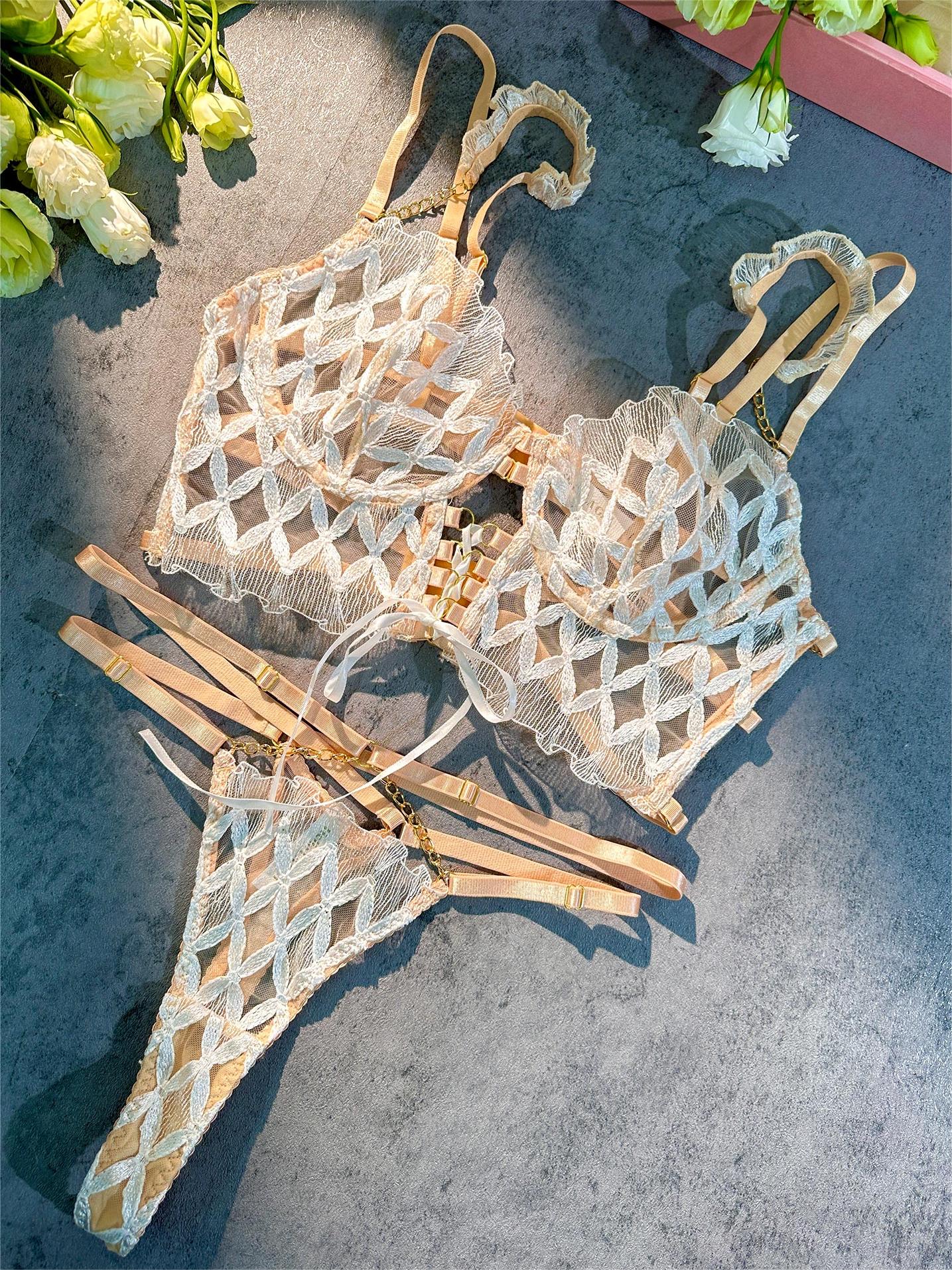 White embroidery lingerie set from Lumina Vancouver, includes two delicate, elegant bras and matching panties.