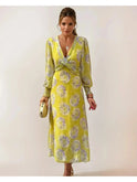 Yellow Delilah Print Twisted Midi Dress by Lumina Wear, showcasing a stylish twisted design and vibrant pattern.