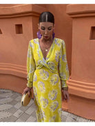 Yellow Huguette Print Twisted Midi Dress by Lumina Vancouver, featuring a vibrant Delilah print and twisted design.