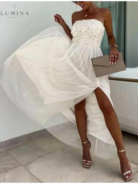White Dorothy one-shoulder flowy maxi dress by Lumina Vancouver, perfect for wedding guest occasions.