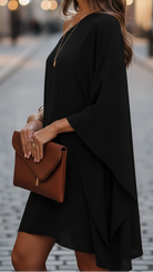 Black Eclipse Nightfall one-shoulder draped mini dress by Lumina Vancouver, showcasing elegant design and stylish fit.