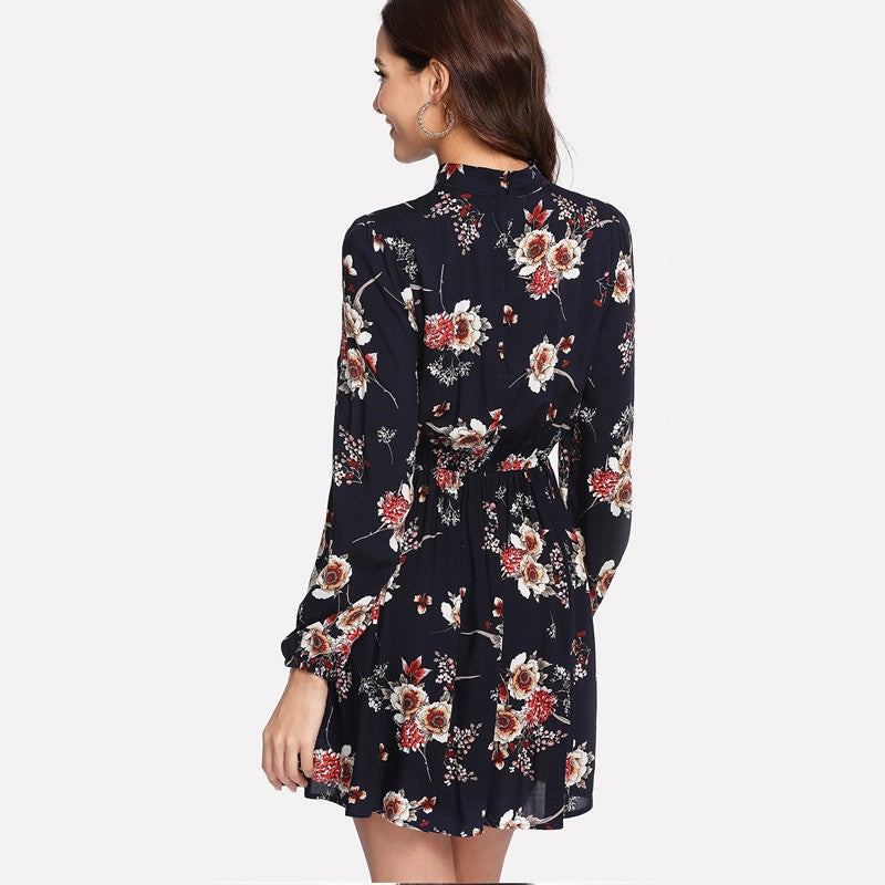 Wenche Bloom Meadow floral mini dress by Lumina Vancouver, dark blue with vibrant flower print, perfect for spring and summer occasions.
