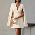 Lumina Wear Elara double-breasted cape mini dress in apricot, featuring a stylish design and tailored fit.