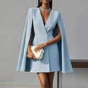 Lumina Wear Elara double-breasted cape mini dress in apricot, featuring a stylish mini dress design with cape detail.