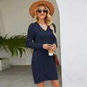 Navy blue Elara Lumina Wear knit mini dress with slim fit and V-neck, shown on a model highlighting its stylish design.