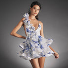Blue Lumina Vancouver Signe mini dress with satin finish and V-neck, shown on a model with a stylish, fitted silhouette.