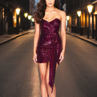 Black Maja off-shoulder sequin mini dress by Lumina Vancouver, featuring shimmering sequins and elegant off-shoulder design.