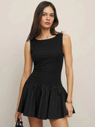 Black sleeveless A-line mini dress by Lumina Vancouver, featuring a fitted bodice and flared skirt, perfect for casual or evening wear.