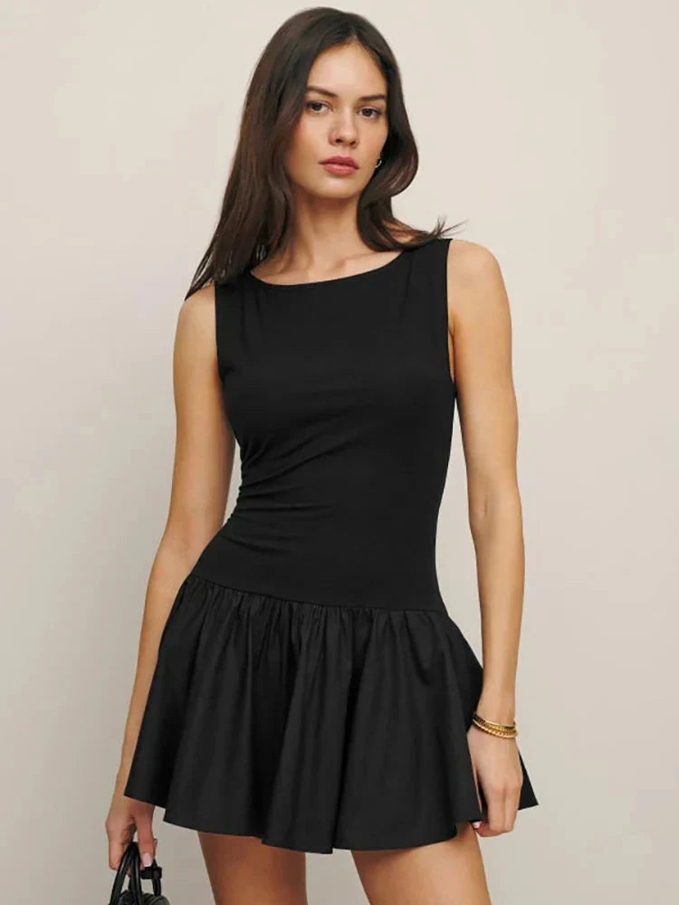 Black sleeveless A-line mini dress by Lumina Vancouver, featuring a fitted bodice and flared skirt, perfect for casual or evening wear.