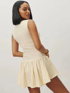 Black sleeveless A-line mini dress by Lumina Vancouver, featuring a fitted bodice and flared skirt, perfect for casual or semi-formal wear.