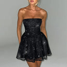 Black Lova strapless slim fit mini dress by Lumina Vancouver, shown on a model, highlighting its fitted silhouette and sleek design.