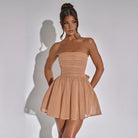 Black Lumina Vancouver Lova strapless slim fit mini dress displayed on a hanger, showcasing its sleek, fitted design.