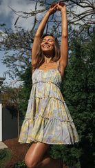 Pink Yrsa tiered ruffle mini dress by Lumina Vancouver featuring layered fabric and delicate ruffle details.