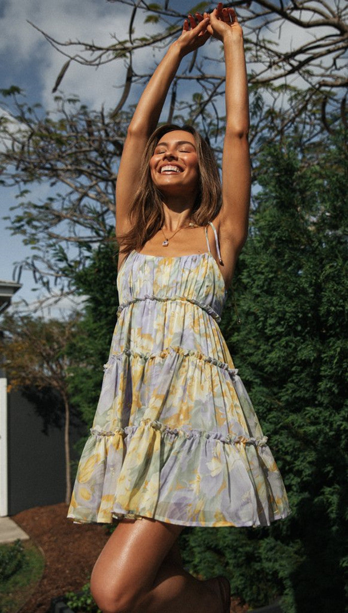 Pink Yrsa tiered ruffle mini dress by Lumina Vancouver featuring layered fabric and delicate ruffle details.