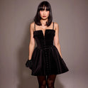 Black velvet Elara A-line mini dress by Lumina Wear, shown on a model with a fitted silhouette and elegant style.