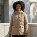 Lumina Wear Eleanor sculpted belted hooded puffer jacket with scallop quilting in brown, featuring a fitted silhouette and cozy design.