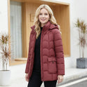 Lumina Wear Eleanor brown hooded puffer jacket with sculpted belt, scallop quilting, and quilted design for women.