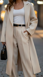 Elena beige belted wrap coat by Lumina Vancouver, shown on a model, featuring a stylish belted design and cozy fabric.