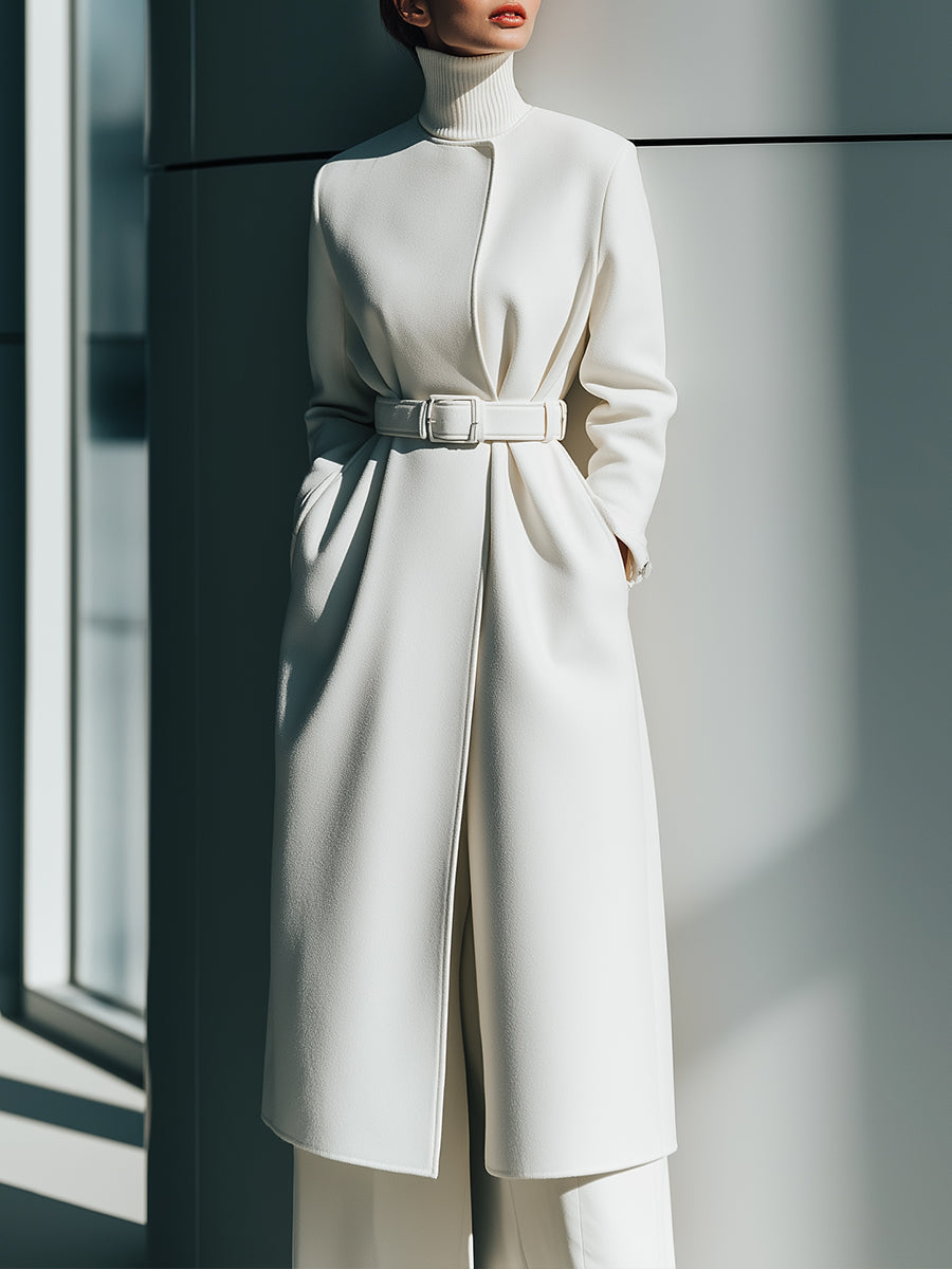 White Renee Lumina Vancouver belted minimalist wool coat with clean lines and tailored fit, shown on a model.