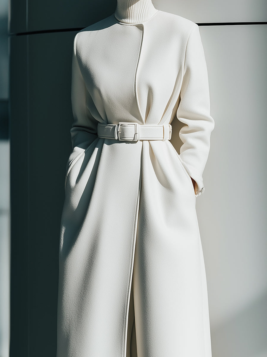 White belted minimalist wool coat by Lumina Vancouver, featuring a tailored fit and clean design for a chic winter look.