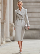Light grey Lumina Vancouver belted wool midi coat on a model, showcasing its tailored fit and stylish design.