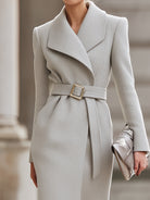 Light grey Lumina Vancouver belted wool midi coat, stylish and warm, displayed on a model showcasing its classic design.