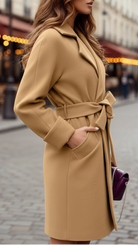 Beige Elena Lumina Vancouver belted wrap coat displayed on a hanger, showcasing its stylish design and cozy fabric.