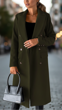Olive green Elena Lumina Wear classic tailored coat with a structured fit and collar, displayed on a hanger.