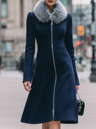 Navy blue Cecile coat with faux fur collar by Lumina Vancouver, featuring a stylish winter outerwear design.
