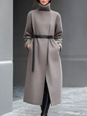Taupe Wilhelmina coat with minimalist belt design by Lumina Wear, shown on a model, size XS, featuring sleek, modern style.