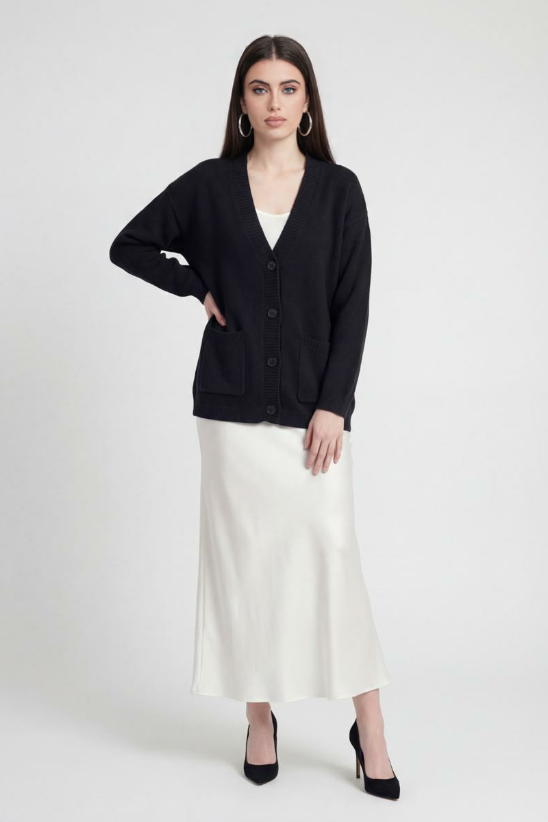 Black knit cardigan named Elena by Lumina Wear featuring ribbed details and a cozy fit, perfect for casual layering.