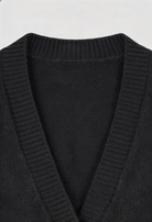 Black knit cardigan by Lumina Wear, Elena, with ribbed details, cozy fit, perfect for layered winter or fall outfits.