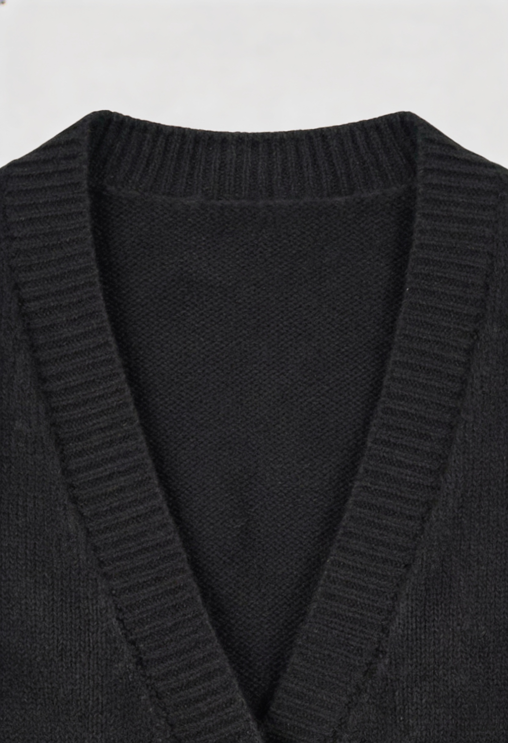 Black knit cardigan by Lumina Wear, Elena, with ribbed details, cozy fit, perfect for layered winter or fall outfits.