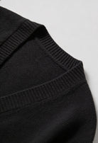 Black knit cardigan with ribbed details from Lumina Wear, featuring a cozy fit and classic style for casual wear.