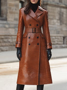 Constance Lumina Vancouver caramel croc-embossed faux leather trench coat with belted waist, shown on a model.