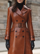 Croc-embossed faux leather trench coat with belted waist by Lumina Vancouver, shown in caramel color, front view.