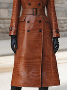 Croc-embossed faux leather trench coat with belted waist in caramel color, by Lumina Vancouver, shown on a model.