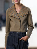 Khaki Selma cropped jacket by Lumina Wear with an oversized plaid collar, shown on a model in natural outdoor setting.