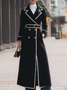 Black Colleen double-breasted belted long coat by Lumina Vancouver, shown on a model with classic lapels and a waist belt.