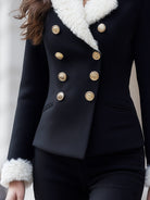 Lumina Wear black double-breasted blazer with faux shearling trim, shown on a model, size XS, stylish and tailored look.