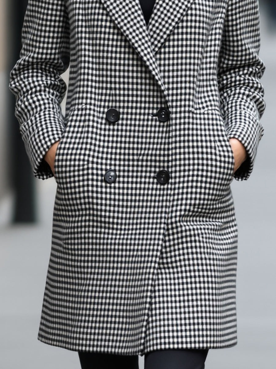 Black Enid double-breasted checked wool coat by Lumina Vancouver, shown on a model in size XS.