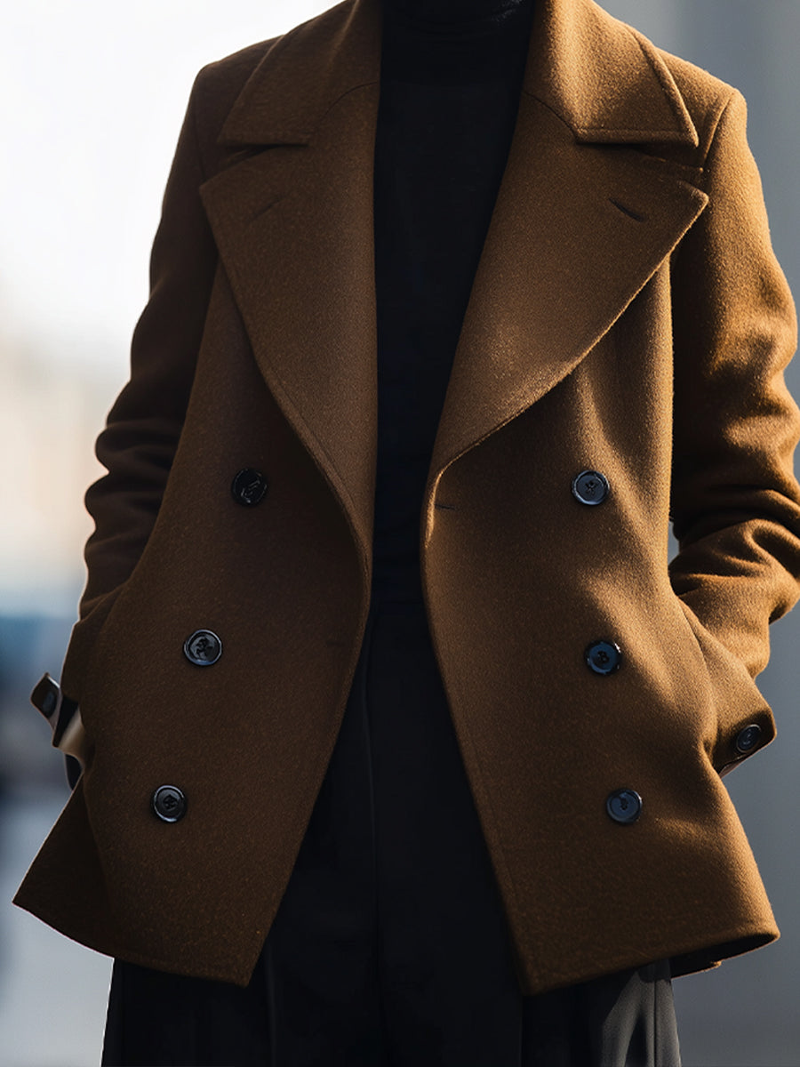 Elena wearing the Lumina Vancouver double-breasted coffee coat jacket, stylish and warm, in a rich coffee color, front view.