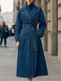 Blue Elena double-breasted denim trench coat by Lumina Wear, shown on a model highlighting classic style and tailored fit.